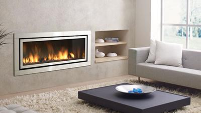 Large direct vent contemporary fireplace, clean edge and surrounds are available. Media choices including stones, pebbles and driftwood logs are available.