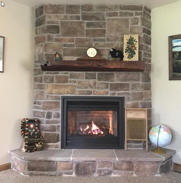 Regency P36D gas fireplace, shown with field stone