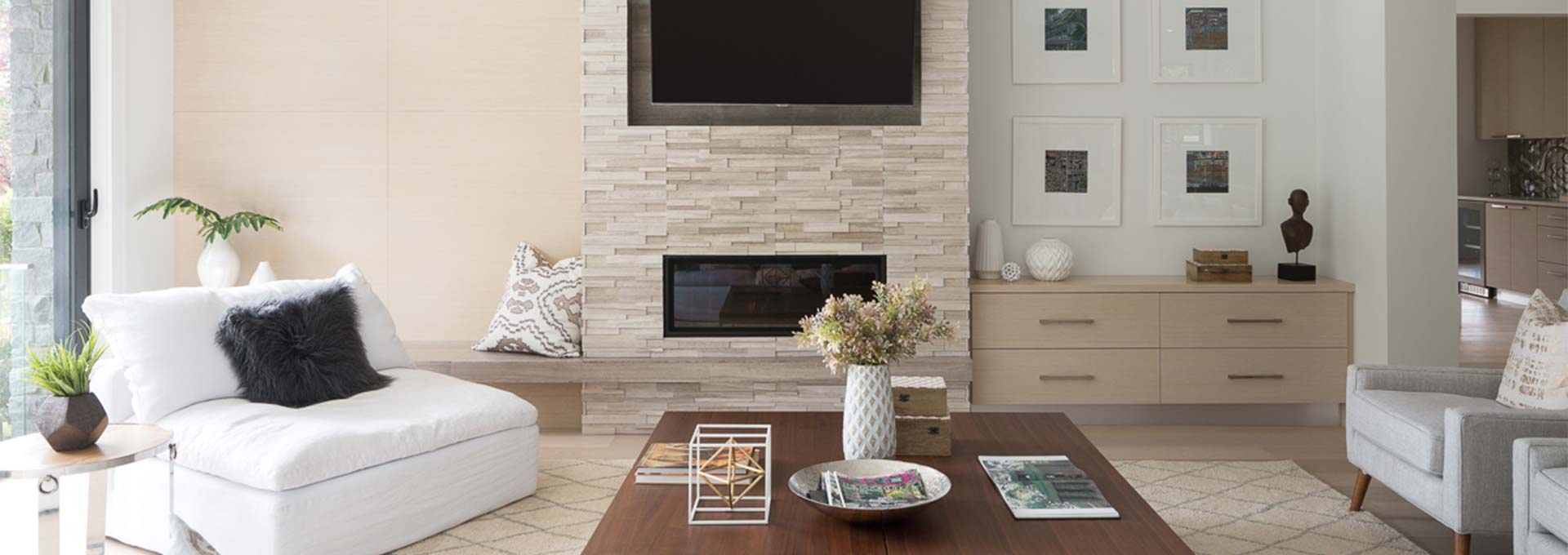 Wood panels, a floating hearth and a built-in cabinet combine to bring balance to a family room fireplace. Design by Teresa Cain. Photo by Barry Calhoun.