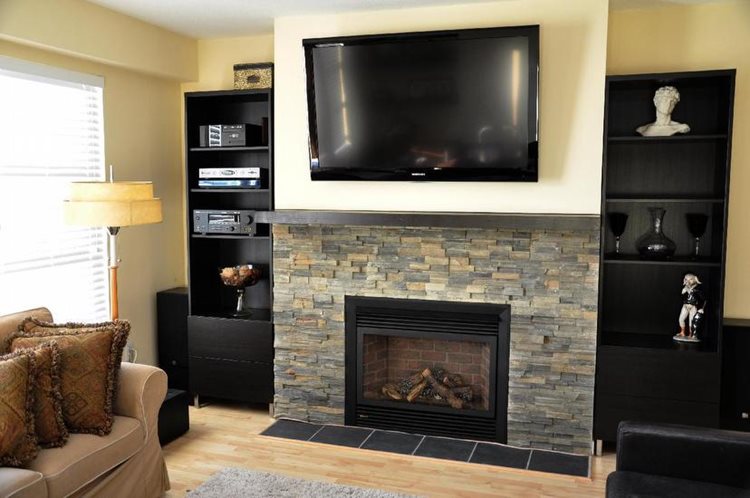 Regency P36 with  Canyon Grey Ledgestone, floating mantel and built in cabinets